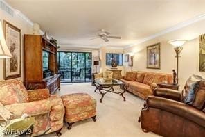 carpeted living room with crown molding and ceiling fan