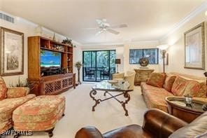 living room featuring ceiling fan and ornamental molding