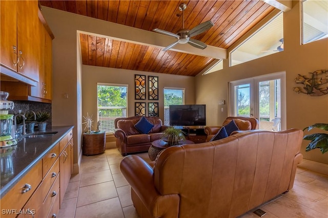 331 Spanish Gold Ln, Upper Captiva, FL 33924 - living room with wooden ceiling, light tile patterned floors, a ceiling fan, and baseboards