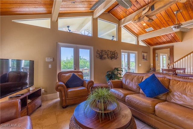 living room with french doors, beamed ceiling, high vaulted ceiling, and ceiling fan