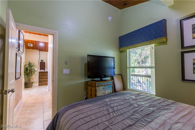 tiled bedroom featuring wood ceiling