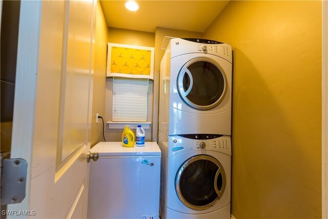 331 Spanish Gold Ln, Upper Captiva, FL 33924 - laundry area with stacked washer / dryer