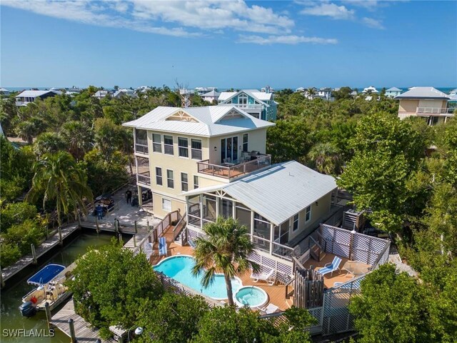 331 Spanish Gold Ln, Upper Captiva, FL 33924 - view from above of property featuring a pool and a tree filled landscape
