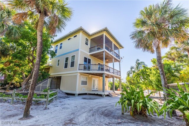 331 Spanish Gold Ln, Upper Captiva, FL 33924 - rear view of property with a balcony, french doors, and ceiling fan