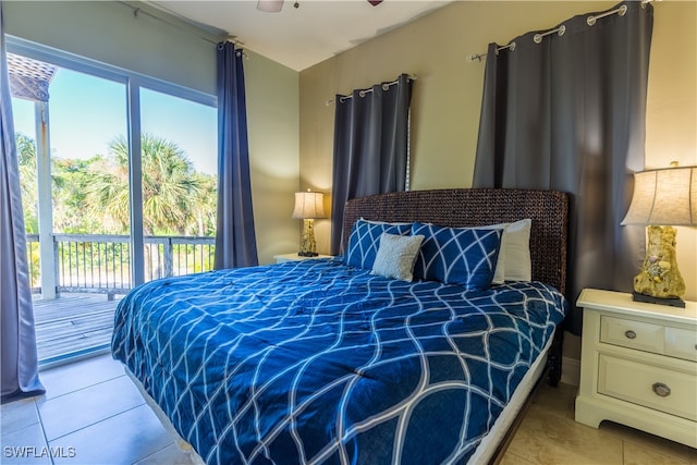 tiled bedroom with access to outside and ceiling fan