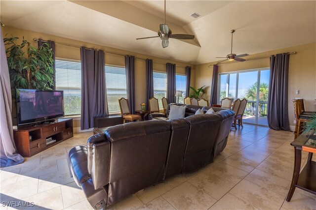 living room with ceiling fan and vaulted ceiling