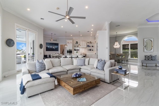 living room featuring ceiling fan and ornamental molding