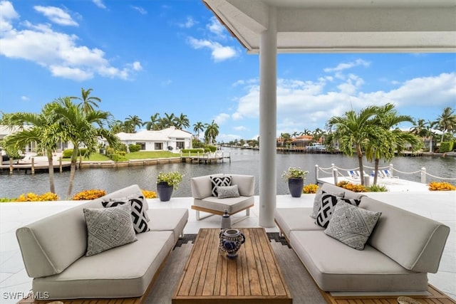 view of patio / terrace with an outdoor living space and a water view