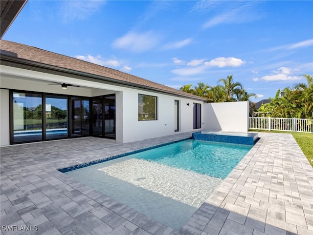 view of pool featuring ceiling fan and a patio