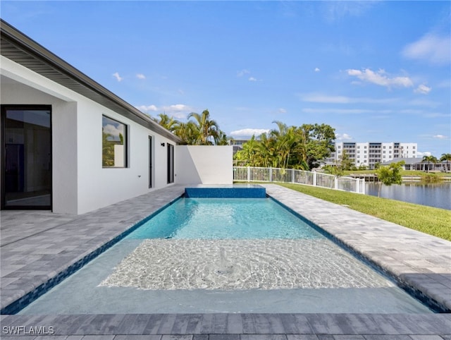 view of pool featuring a patio and a water view