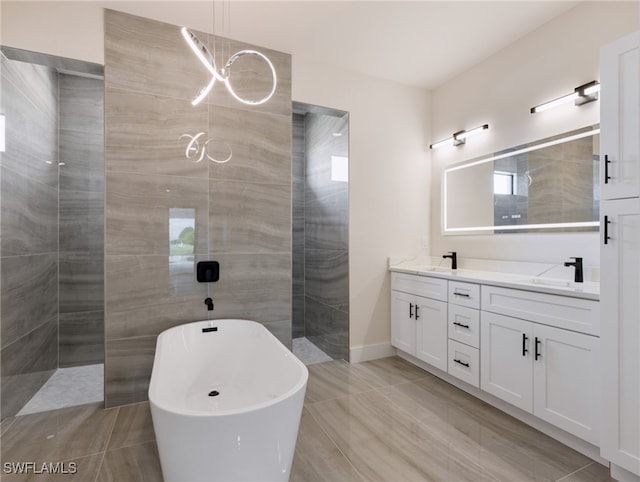 bathroom with hardwood / wood-style floors, vanity, and independent shower and bath