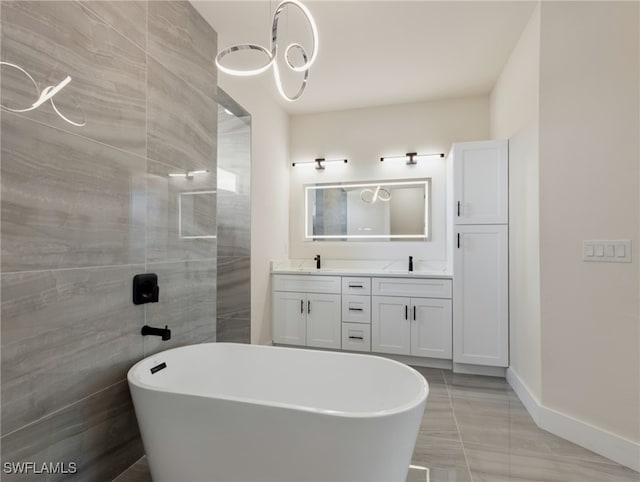 bathroom with a washtub and vanity