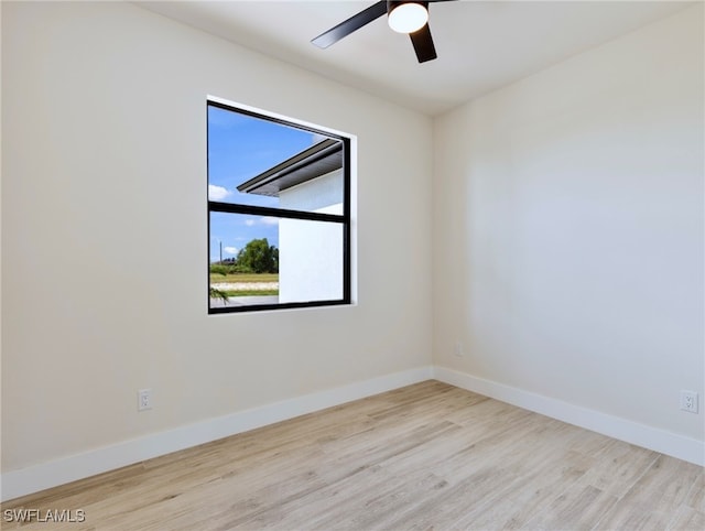 empty room with light hardwood / wood-style floors and ceiling fan