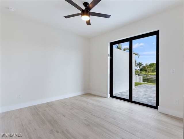 empty room with light hardwood / wood-style floors and ceiling fan