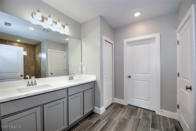 bathroom featuring vanity and a tile shower