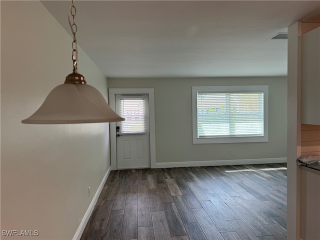 foyer with dark hardwood / wood-style floors