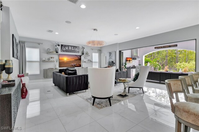 14690 Reserve Pl, Naples, FL 34109 - living room with light marble finish floors and recessed lighting