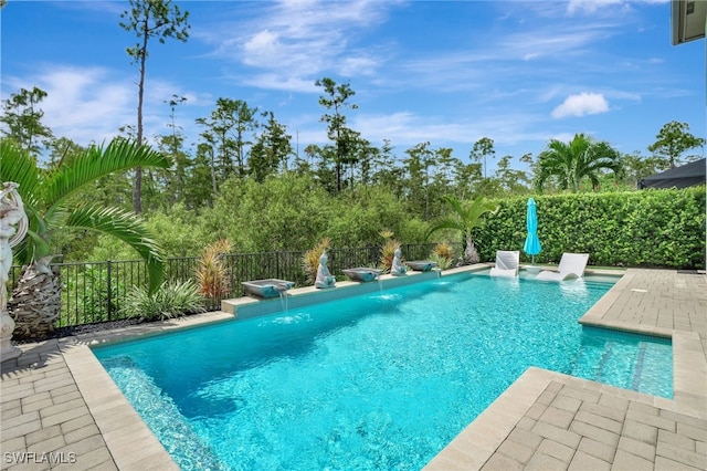 view of swimming pool with pool water feature