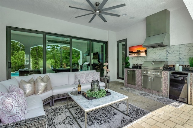 view of patio featuring area for grilling, ceiling fan, a grill, and an outdoor hangout area