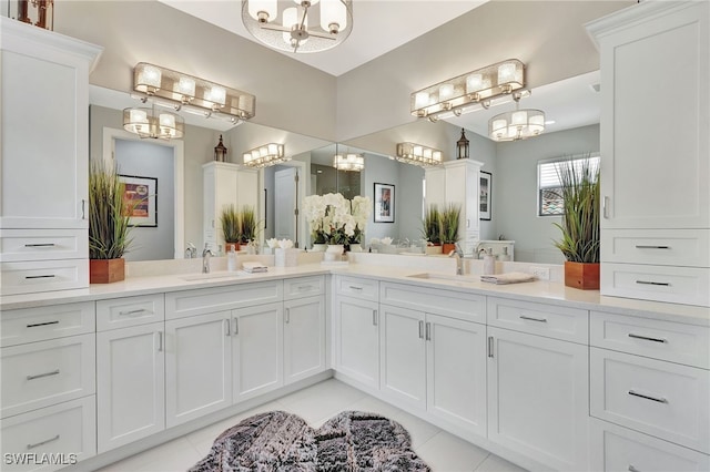 14690 Reserve Pl, Naples, FL 34109 - bathroom featuring a chandelier, tile patterned floors, and vanity