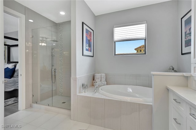 bathroom featuring vanity, separate shower and tub, and tile patterned floors