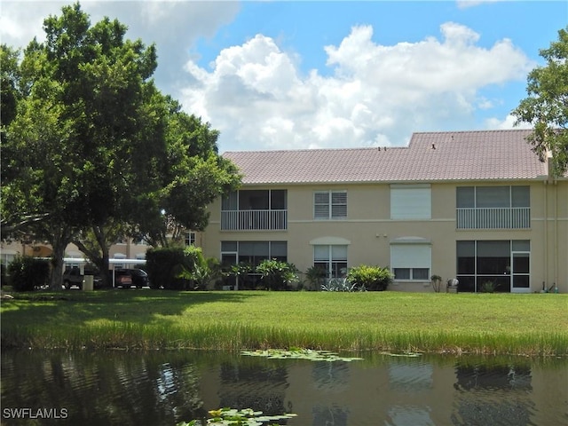 view of building exterior featuring a water view