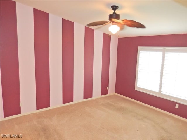 carpeted empty room with ceiling fan