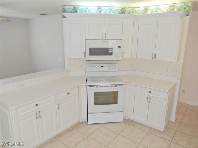 kitchen featuring white cabinetry, white appliances, light tile patterned flooring, and kitchen peninsula