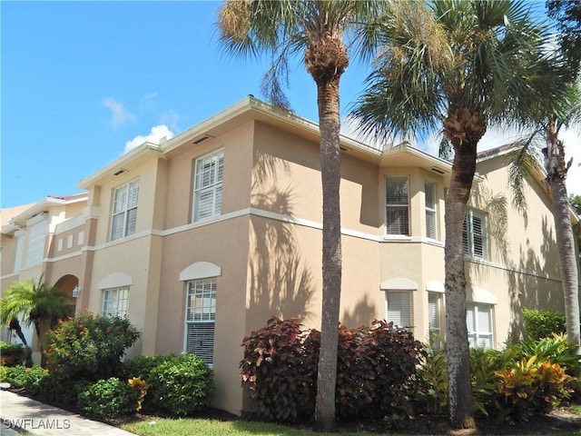 15000 Bridgeway Ln Unit 208, Fort Myers, FL 33919 - view of home's exterior featuring stucco siding