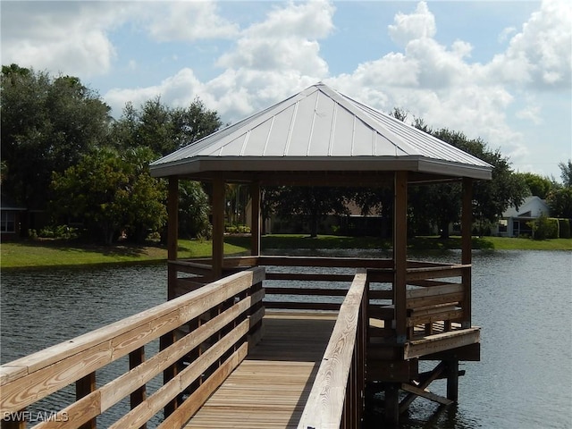 dock area with a gazebo and a water view