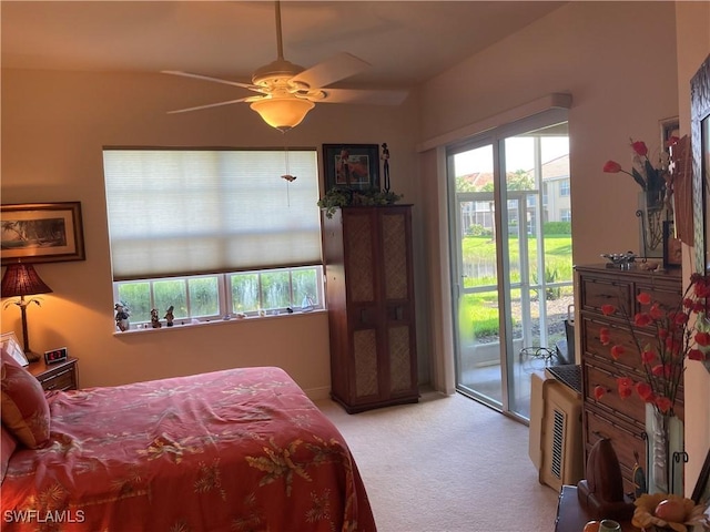 bedroom featuring ceiling fan, access to outside, and light colored carpet