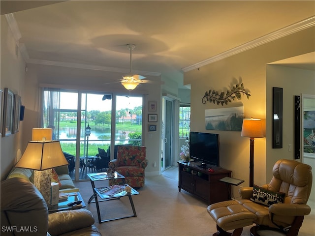 living room with carpet flooring, ceiling fan, and ornamental molding