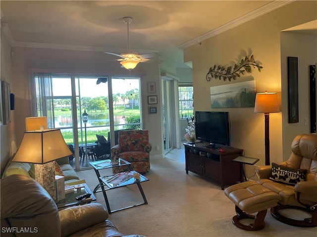 carpeted living room with crown molding and ceiling fan