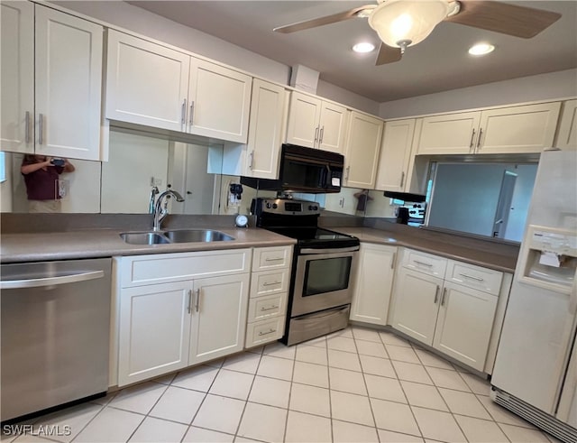 kitchen featuring ceiling fan, white cabinets, light tile patterned flooring, sink, and stainless steel appliances