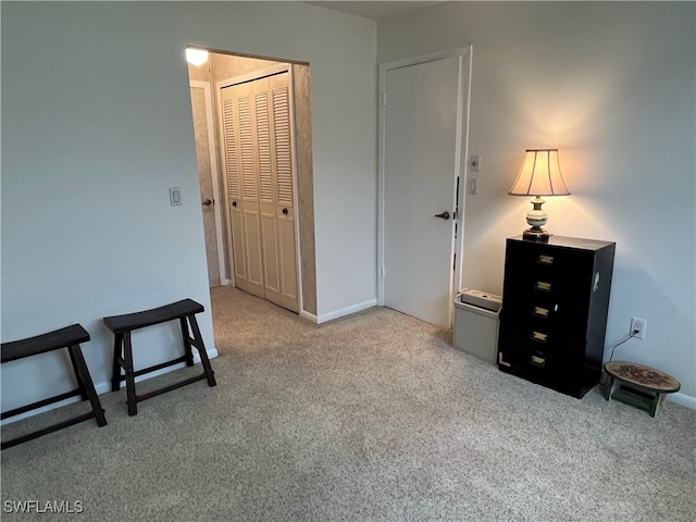 carpeted bedroom with a closet