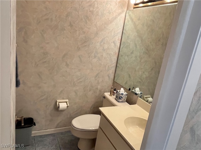 bathroom with vanity, toilet, and tile patterned floors