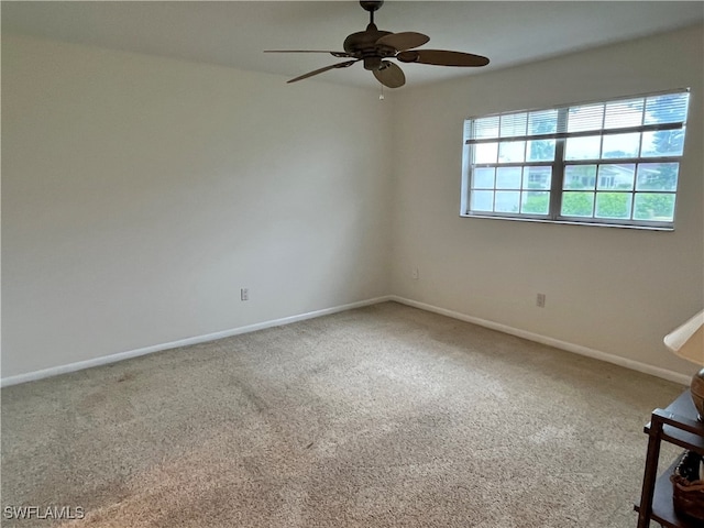 unfurnished room featuring carpet floors and ceiling fan