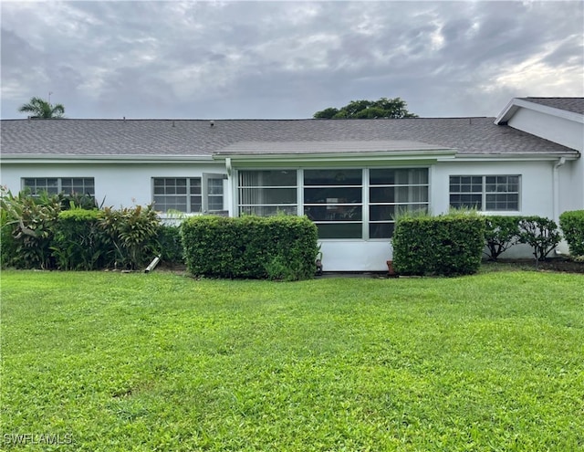 view of side of home featuring a lawn