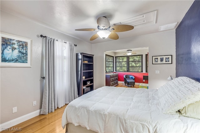 bedroom featuring ceiling fan and hardwood / wood-style flooring