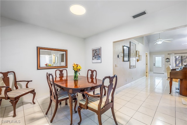 dining room featuring ceiling fan and light tile patterned flooring