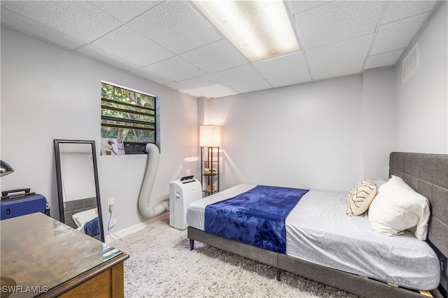 bedroom with a drop ceiling