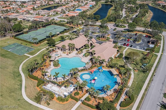 birds eye view of property featuring a water view