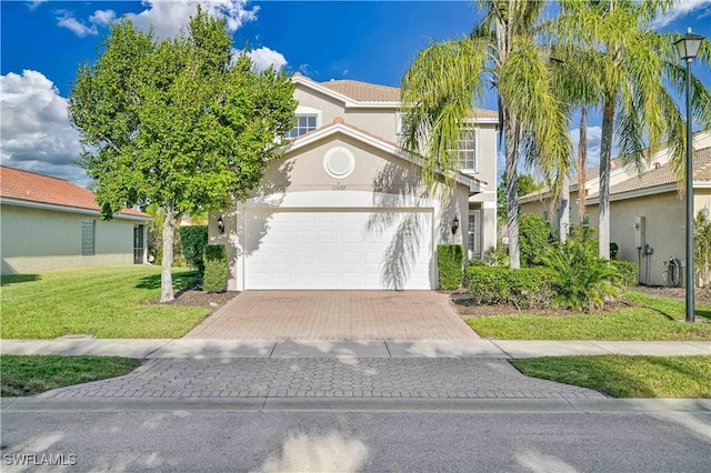 view of front facade with a front yard and a garage