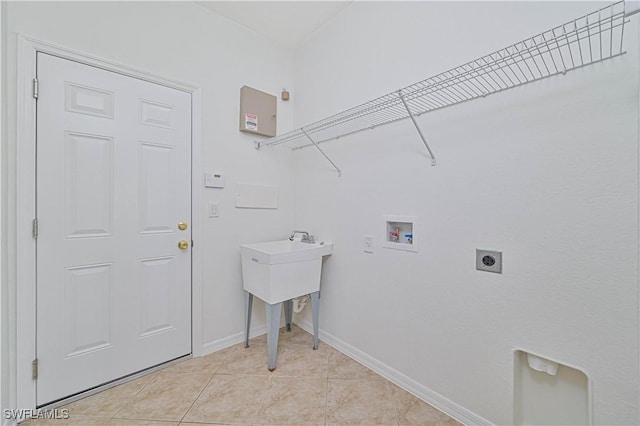 laundry room featuring electric dryer hookup, light tile patterned flooring, and washer hookup