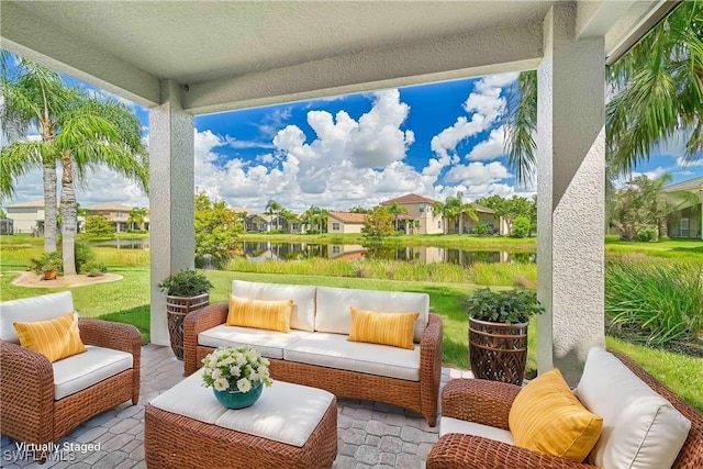 view of patio / terrace featuring an outdoor hangout area and a water view