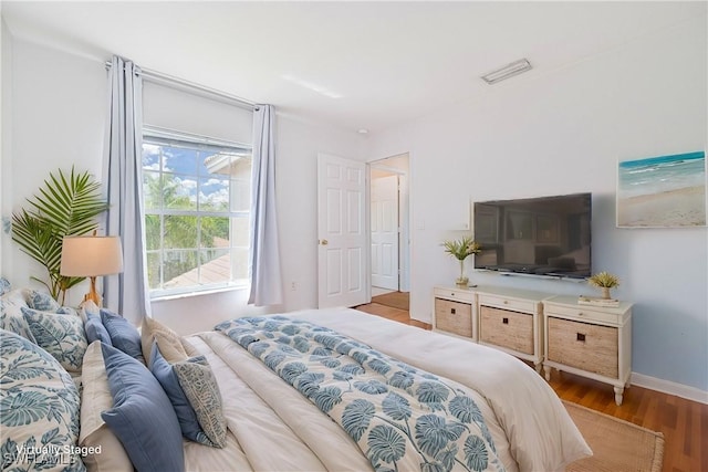 bedroom with light hardwood / wood-style floors