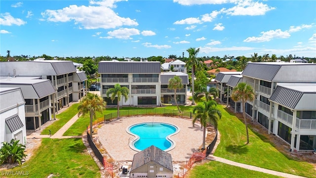 view of pool featuring a yard