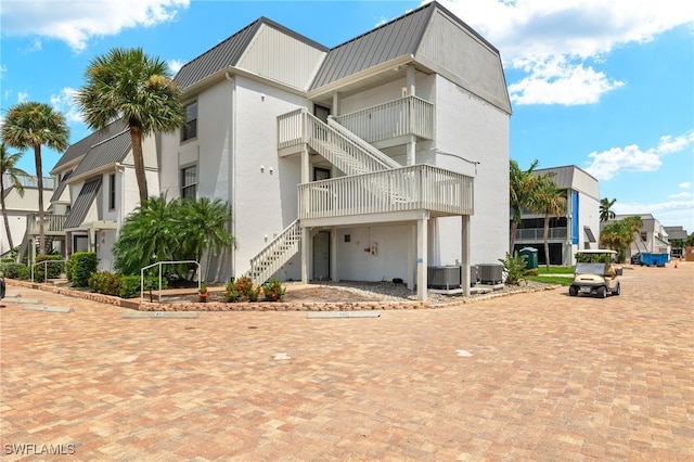 exterior space featuring a balcony and central AC unit