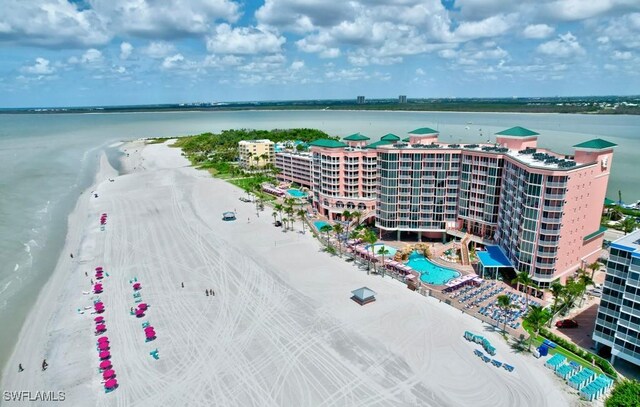 bird's eye view featuring a view of the beach and a water view