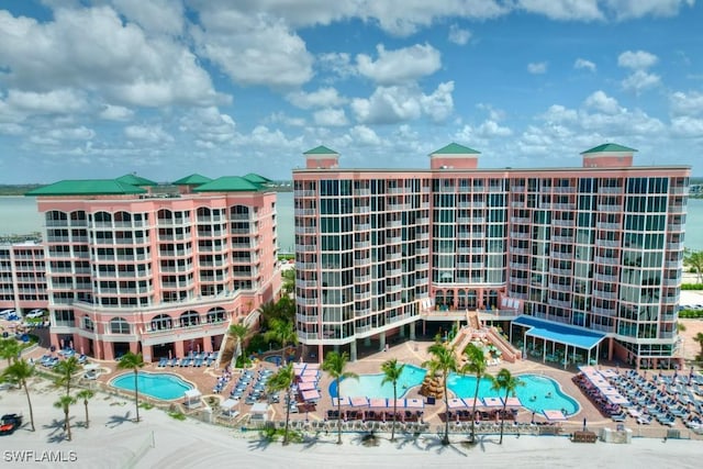 view of building exterior with a community pool